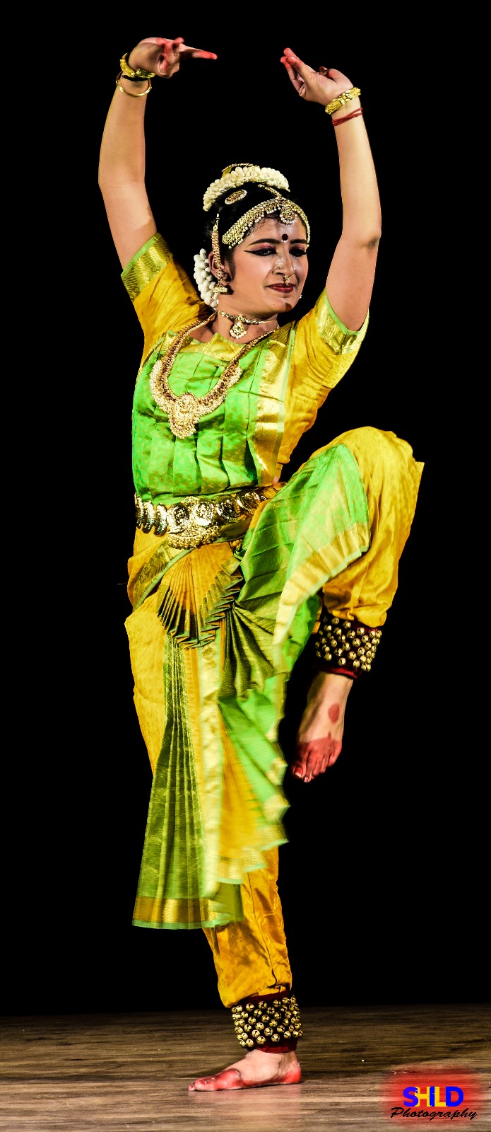 Prathiba performing a solo Bharatanatyam piece on stage